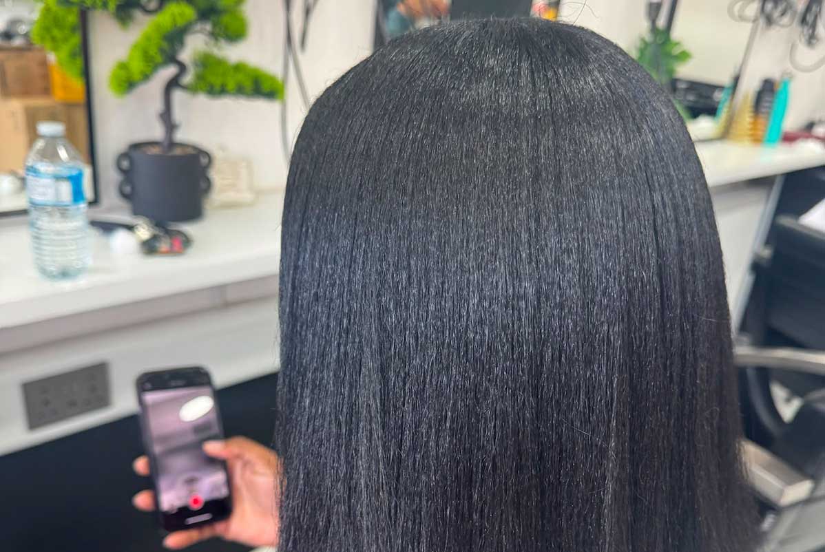 Hair carefully blow-dried before a silk press
